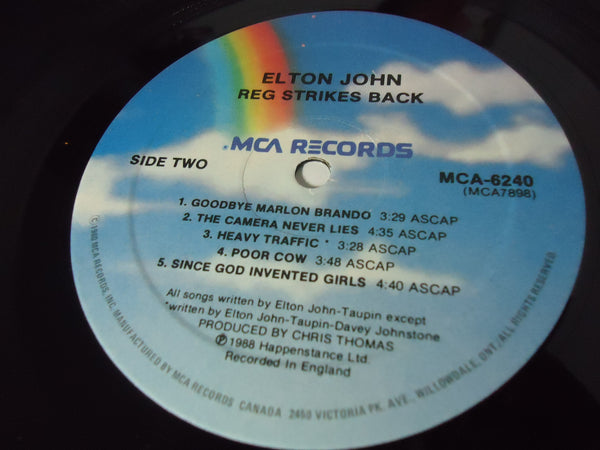 Elton John ‎– Reg Strikes Back